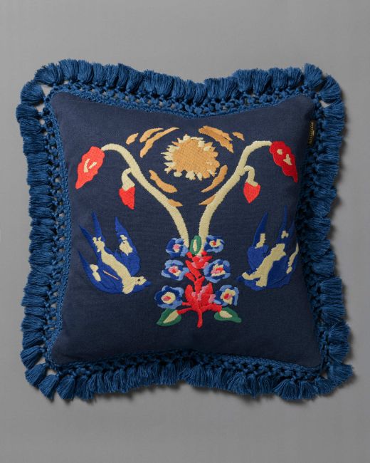 A SWALLOW'S HORIZON embroidered cushion