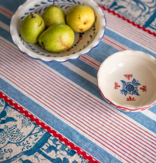Pears in a patterned bowl on the NOCHRICH table runner